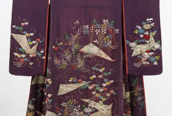 A purple kimono with floral embroidery.