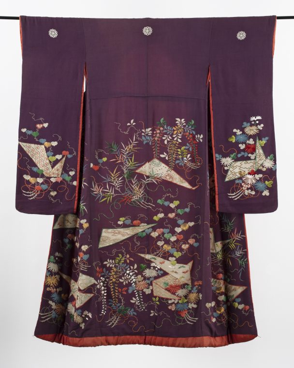 A purple kimono with floral embroidery.