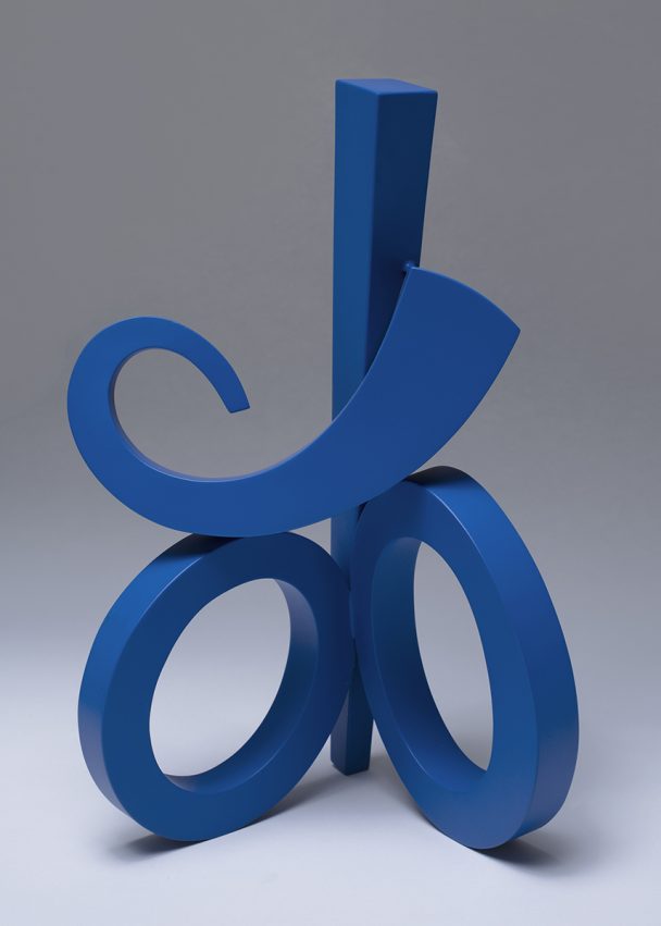 Blue sculpture with curves and circles.