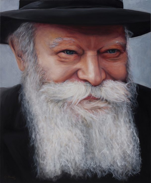 Portrait of an elderly man with a long white beard and black hat.