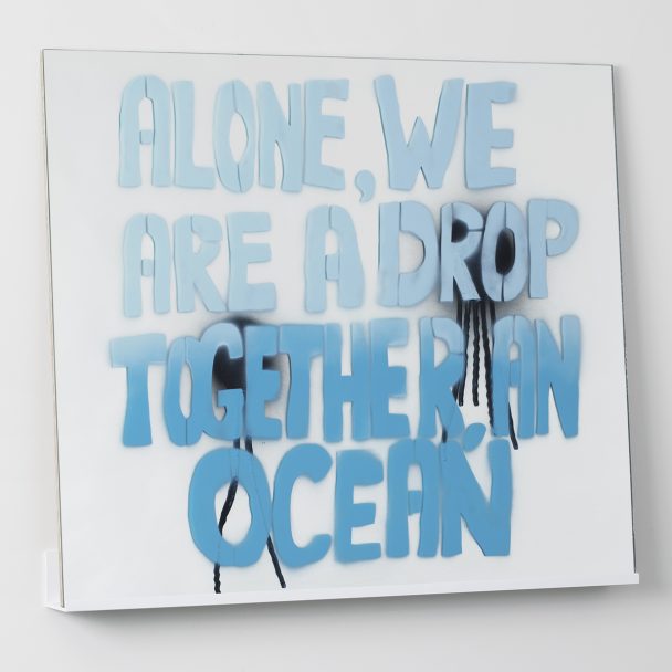 Blue spray-painted quote on a white background.