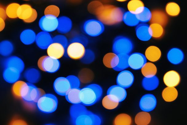 Blue and yellow blurred Christmas lights.