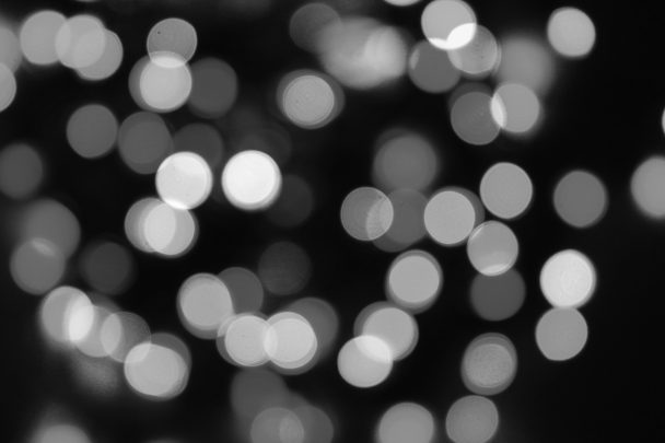 Black and white blurred Christmas lights.